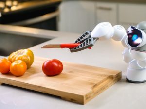 a robot chops up some tomatoes